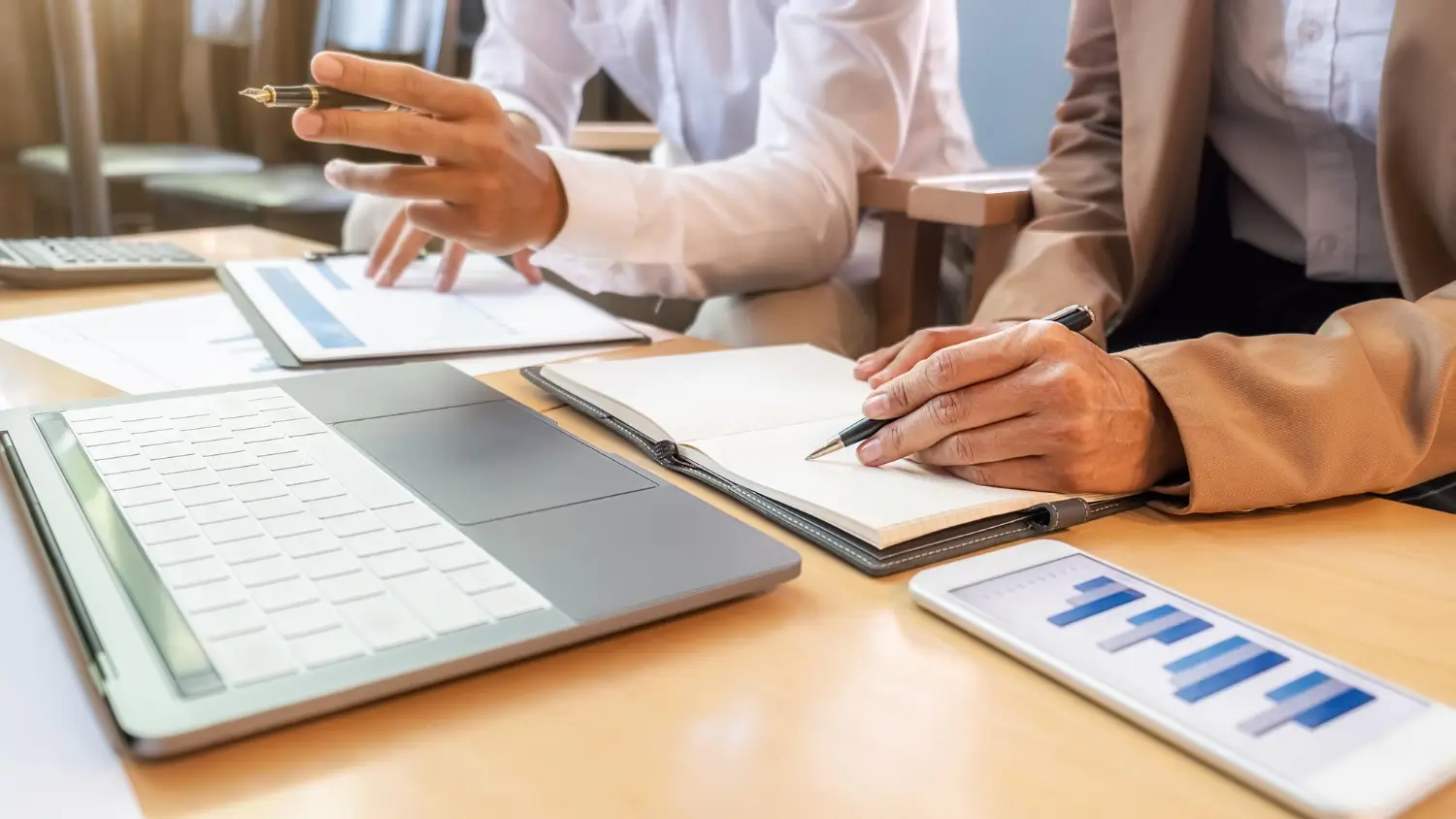 Auditor reviewing corporate tax and deferred tax figures in a company's financial statements during a UAE statutory audit.